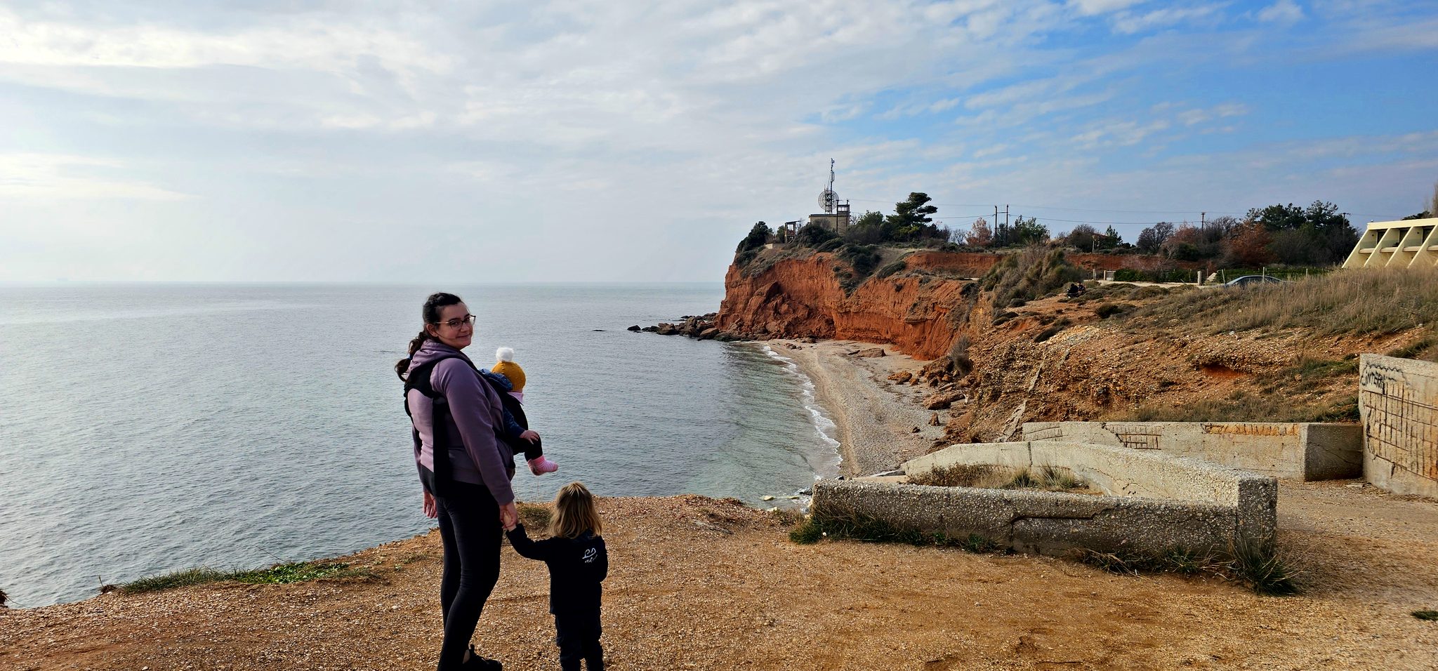 Red cliffs above a quiet winter beach