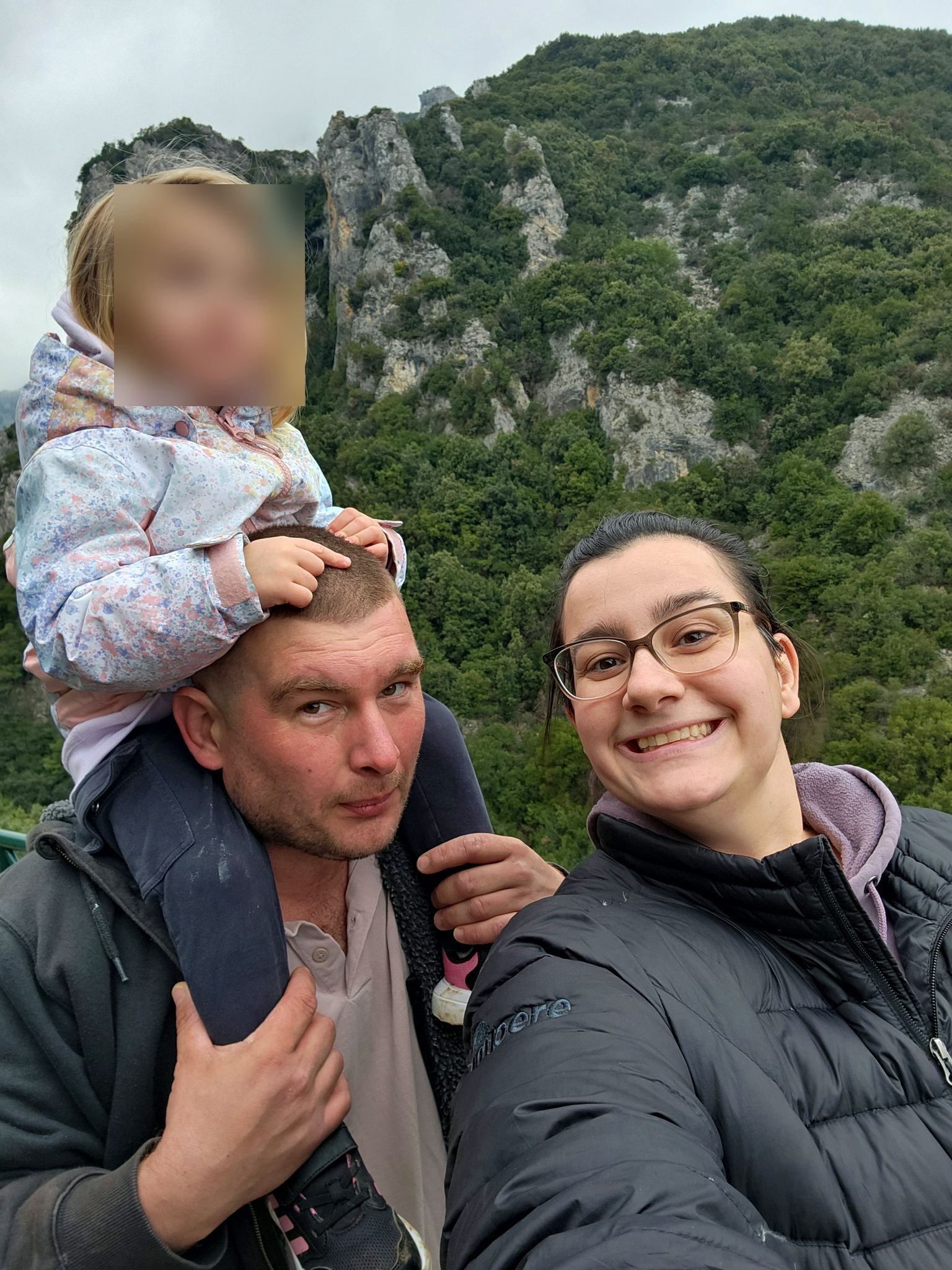 Family selfie under the cliffs