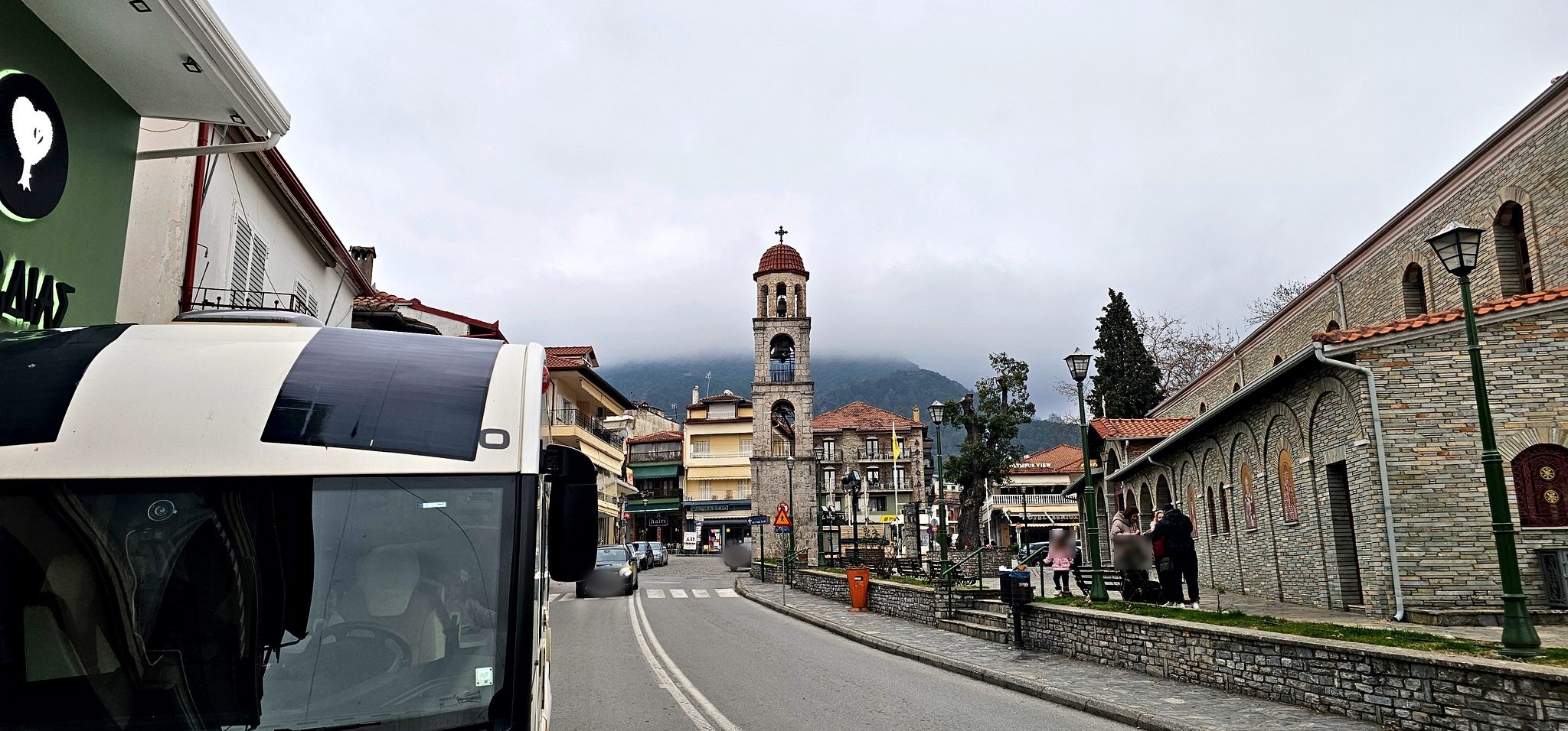 Camper rolling down a narrow village street