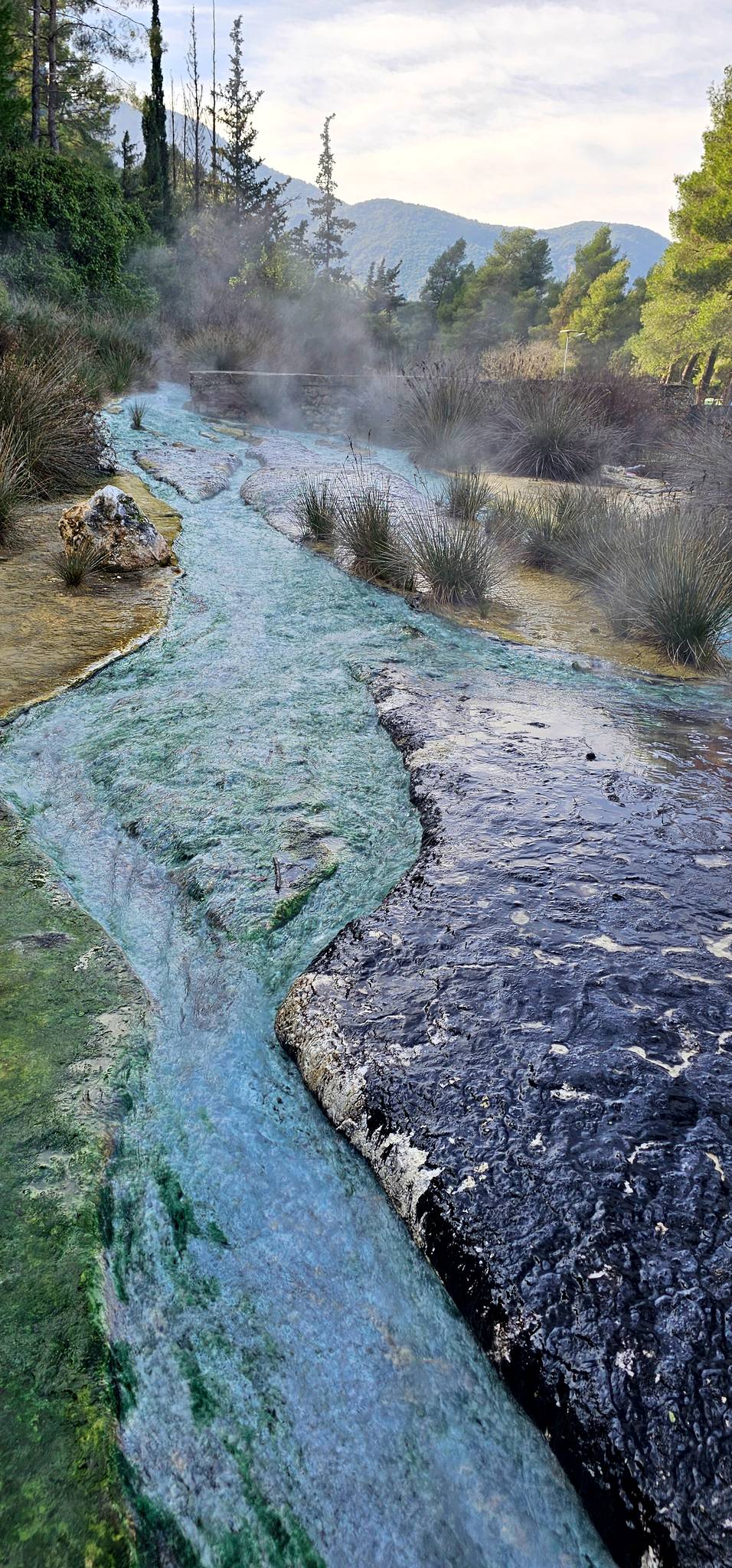 Natural pools with steam coming off them