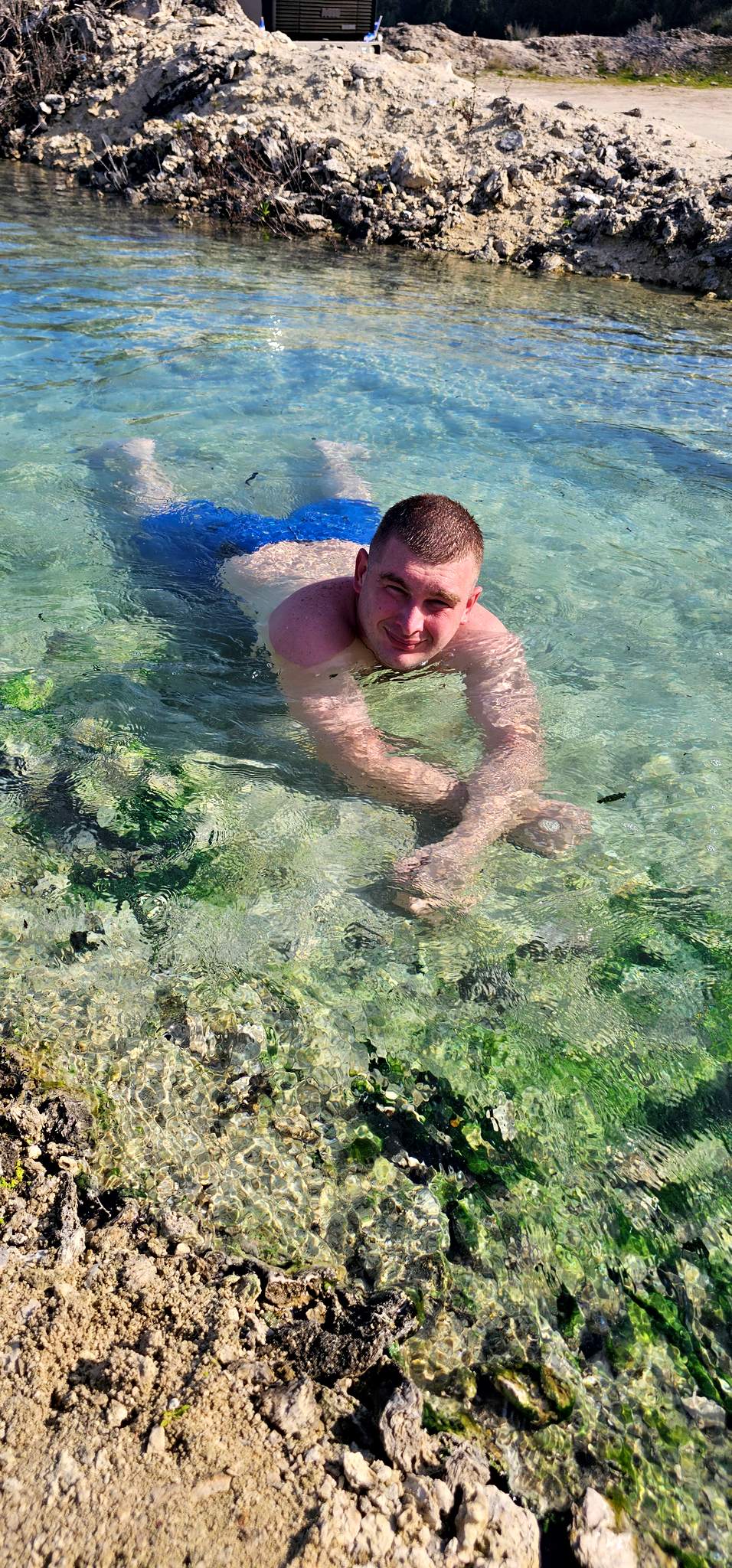 Dad floating in clear warm water