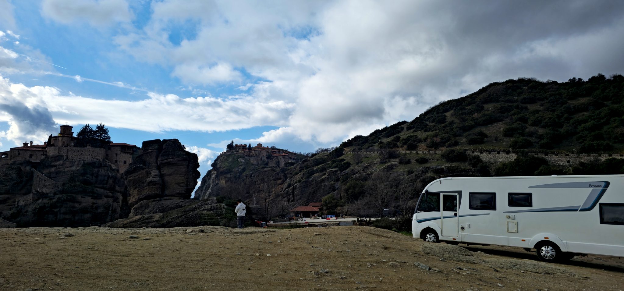 Family camper parked among giant rocks