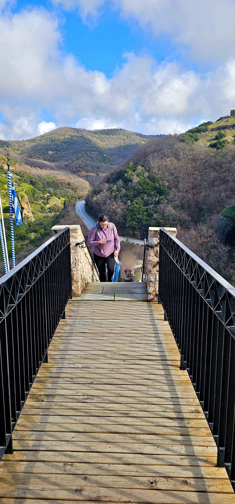 Narrow footbridge across to the monastery gate