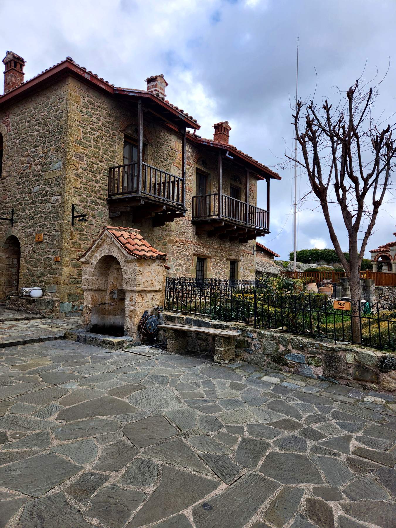 Stone and wood buildings around a quiet courtyard