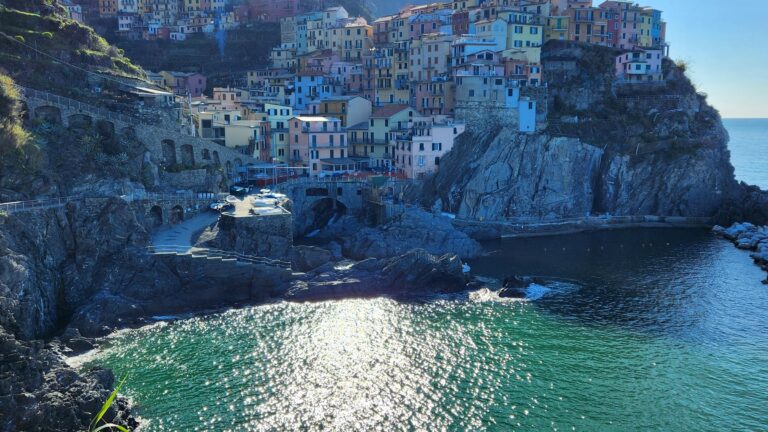 Manarola, Riomaggiore by bike, and holding up the Leaning Tower